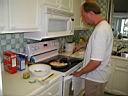 P1010241.jpg: Sean frying up more shrimp at the condo